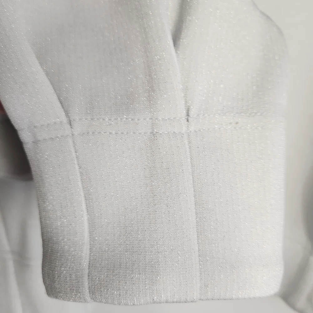 Badgley Mischka White Top with Subtle Metallic Trim - Picture 4 of 9